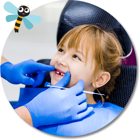 dentist examining a young girl's teeth
